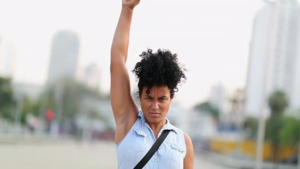 Strong Black Woman Raising Fist Air Looking Camera Protesting — 비디오