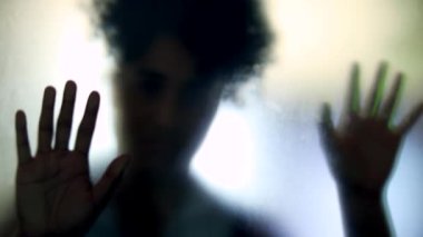 Woman feeling trapped behind glass, depression mental illness concept