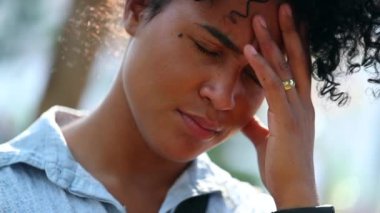 Mixed race African woman having headache