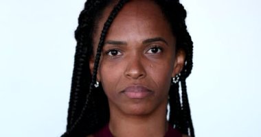 African woman closes eyes in meditation, close-up portrait face closing eye in contemplation