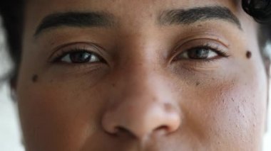 Serious young black mixed race woman portrait looking at camera