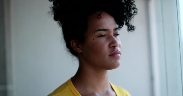 Thoughtful Young Black Woman Looking Out Home Window — Vídeo de Stock