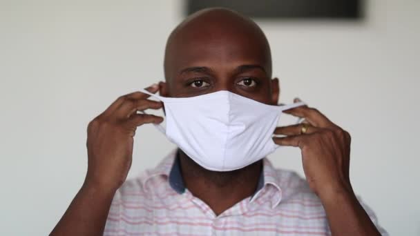 African Man Putting Surgical Face Mask Prevention Covid — Stockvideo