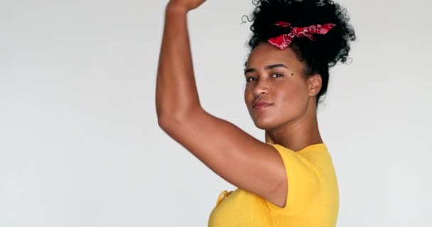 Confident Black African Woman Doing Symbolic Feminist Muscle Pose — Stockvideo
