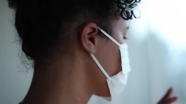 Woman Wearing Surgical Mask Standing Window Lockdown Pandemic — Stockvideo