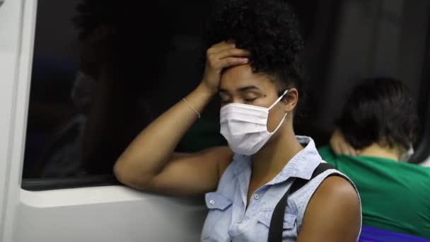 Tired Young Black Student Riding Metro Wearing Preventive Surgical Mask — Vídeo de Stock