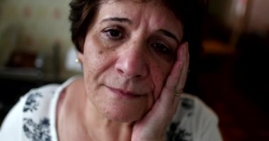 Depressed older woman feeling sad, Sad senior 60 year old lady suffering