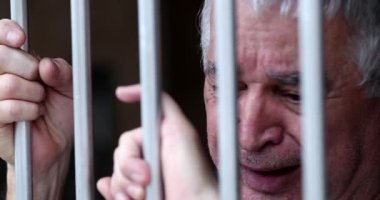 Depressed crying senior man. Tearful sad older person suffering with sorrow