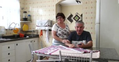 Older couple bursting laughing out loud