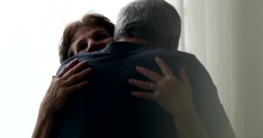 Candid senior couple hugging embracing each other. Loving older relationship