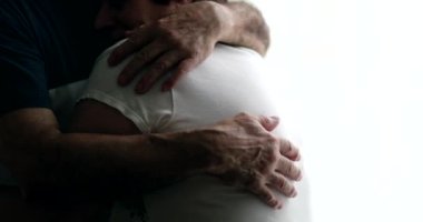 Married older couple embrace. Senior close-up hands hug