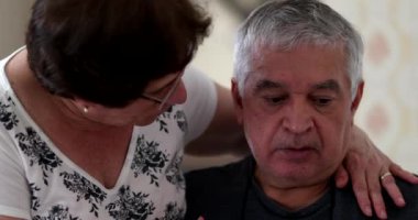 Worried older man seeking consolation by wife. Married senior couple struggling with old age