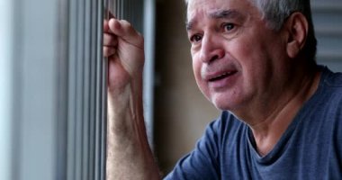 Crying older senior man. Depressed sad elder retired person