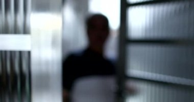 Old man opening front door, senior stepping outside after quarantine