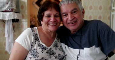 Casual married middle aged couple smiling, real people