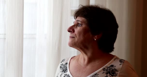 Pensive Worried Older Woman Standing Window Looking — Vídeos de Stock