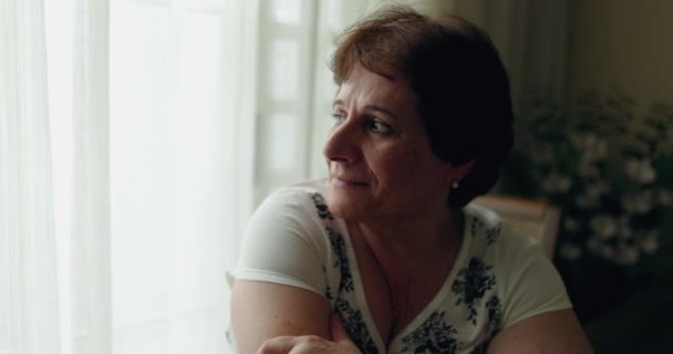 Pensive Older Senior Woman Sitting Home Window — Vídeos de Stock