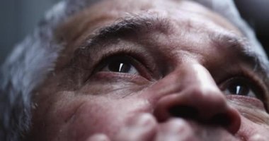Spiritual older man closing eyes in contemplation, person feeling the presence of God