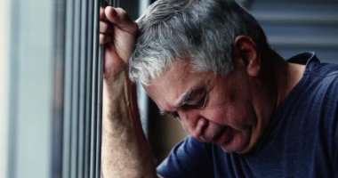 Senior man crying, person in emotional distress. Old man in pain