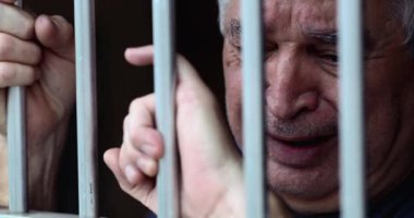 Depressed person lock behind metal bars