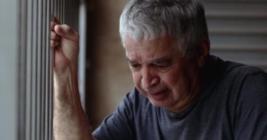 Old man in crisis crying. Senior person suffering from depression and anxiety