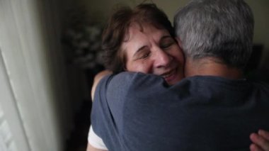 Older couple hugging each other. Senior husband and wife love and affection