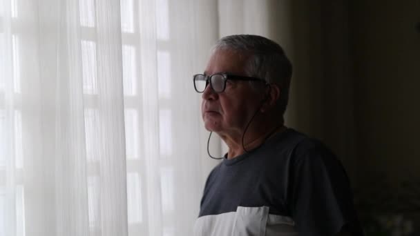 Concerned Older Man Standing Window Home — Stockvideo