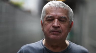 Older man smiling at camera. casual person, real people series