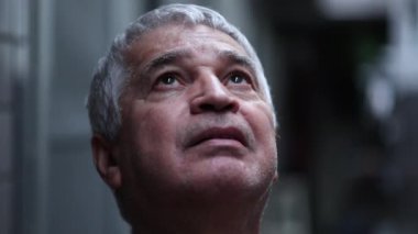 Senior person looking at sky looking for support and help