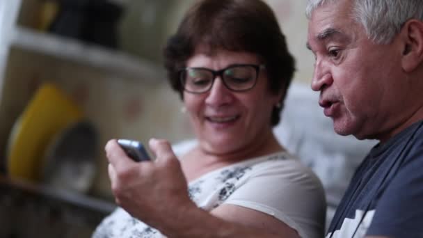 Senior Husband Showing Cellphone Screen Wife Celebrating News — Stockvideo