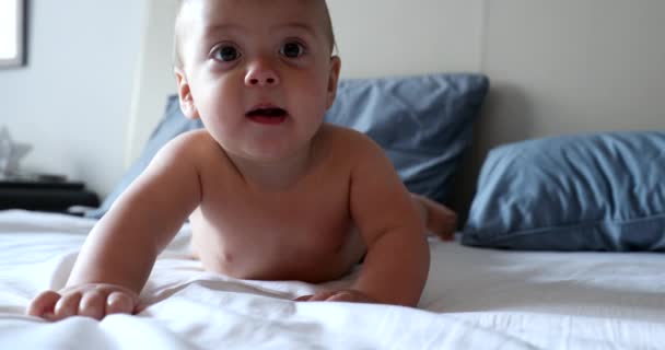 Cute Baby Face Bed Looking Camera — Stockvideo