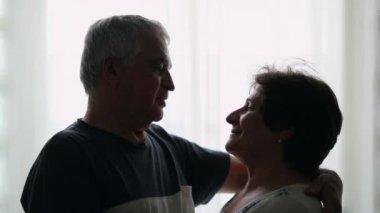 Older couple looking at each other