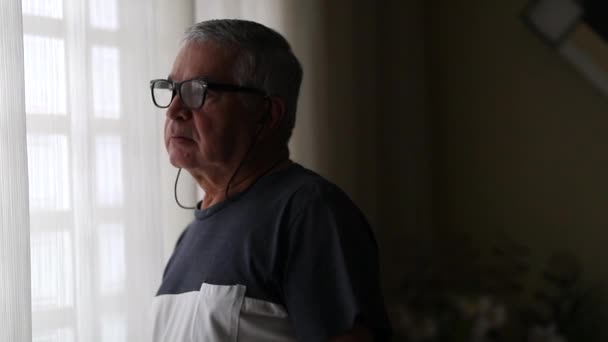 Senior Man Standing Window Observing Curtains Peeking — Stockvideo