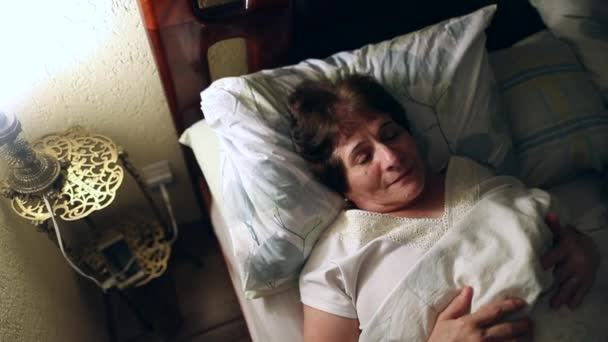 Woman Lying Bed Turning Nightstand Lamp — Stock videók