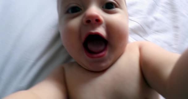 Baby Grabbing Camera Lens Pov Dad Filming Toddler Infant Bed — Video