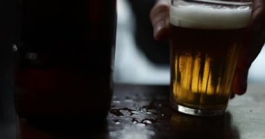 Close-up of beer glass at bar after drinking