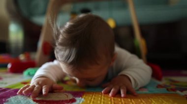 Baby toddler on home floor exploring