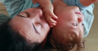 Child and mother upside down together
