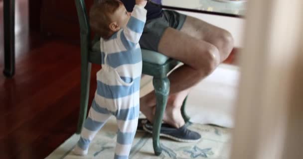 Candid Baby Standing Next Grandpa While Eating Morning Breakfast — Video