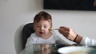 Baby not wanting food, infant toddler shaking head denying feeding