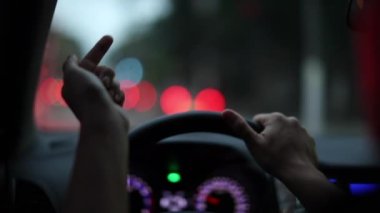 POV driver holding steering wheel driving