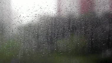 Randrops droplets on window during rainy day
