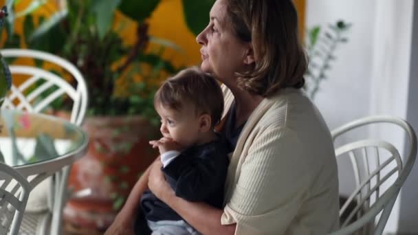 Casual Grandmother Kissing Infant Grandchild Cheek Candid Grandma Holding Toddler — Stok video