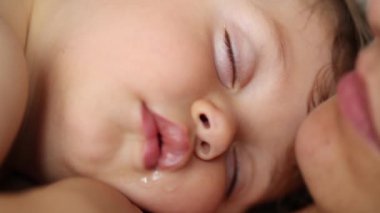 Cute baby infant sleeping with drool from mouth