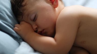 Cute baby sleeping. Infant one year old toddler asleep napping, calm and rest