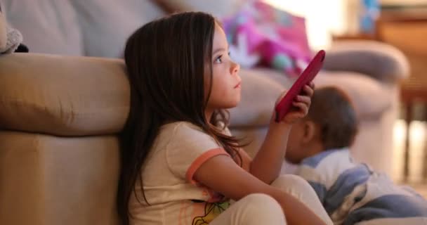 Casual Little Girl Watching Screen Holding Smartphone Device Night — Stock Video