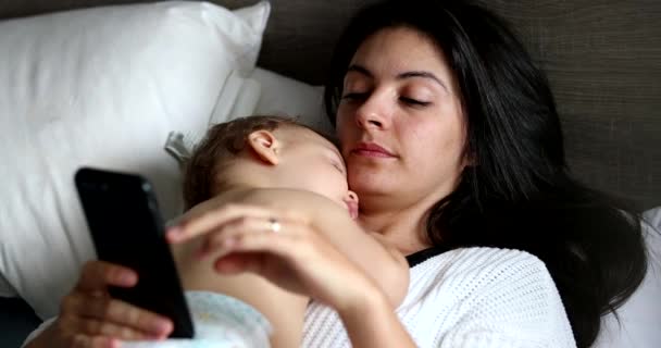 Mother Sleeping Baby Checking Smartphone Bed — Video