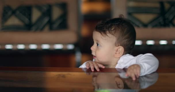 Cute Baby Holding Table Peeking Out Adorable Toddler Leaning Table — Videoclip de stoc