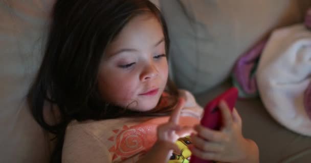 Small Girl Using Smartphone Device Night Little Child Holding Cellphone — Stockvideo