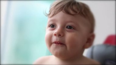 Happy beautiful baby toddler infant, one year old child smiling face portrait